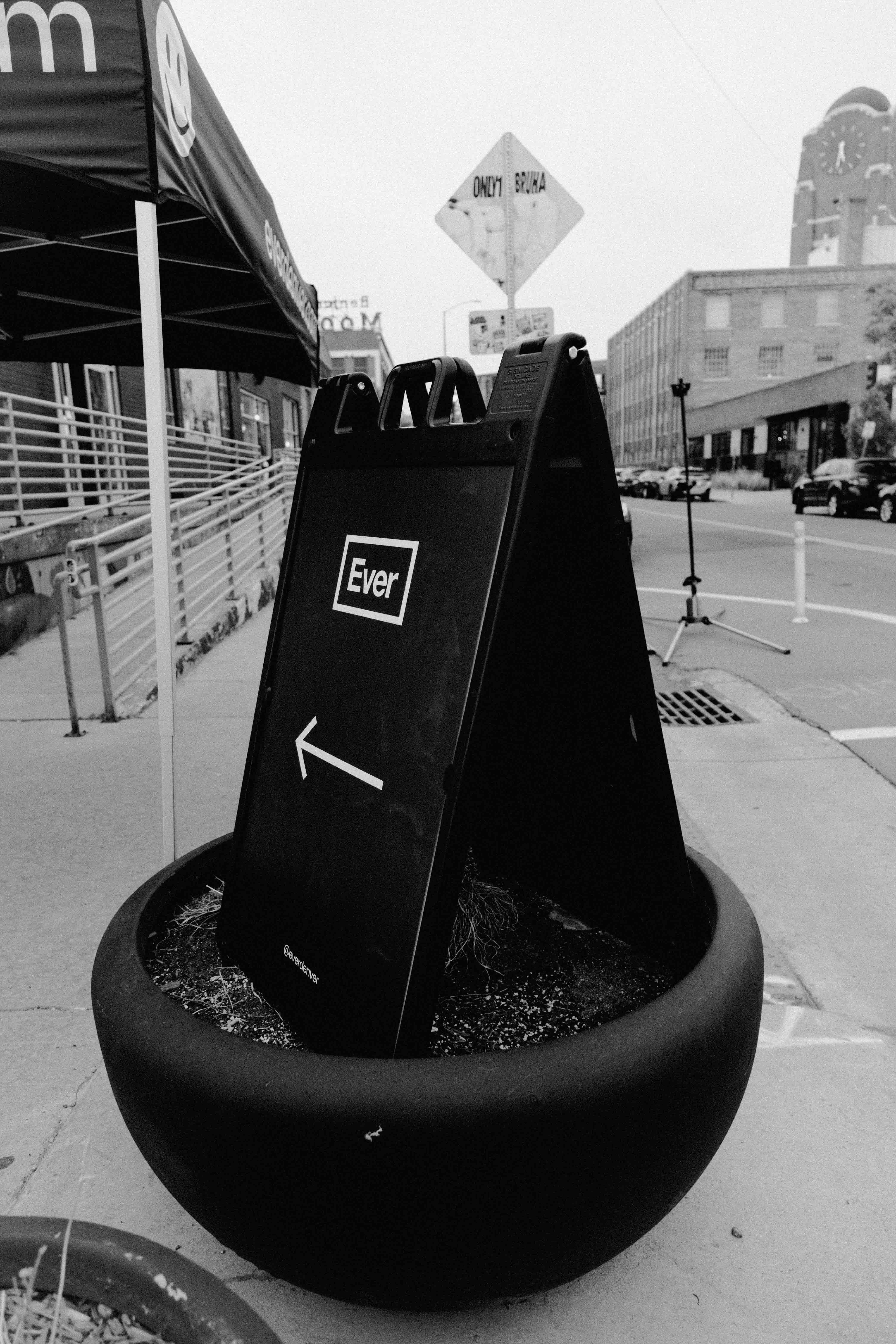 Ever Denver sidewalk sign on a Denver street